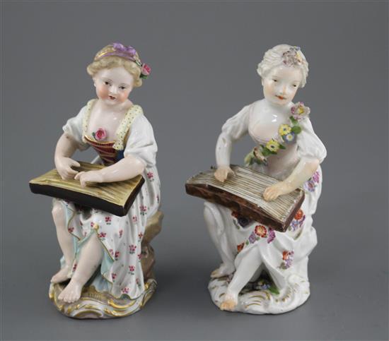 An 18th century Meissen figure of a girl playing a zither and a 19th century Meissen figure of a girl playing a zither, 12cm and 12.4cm